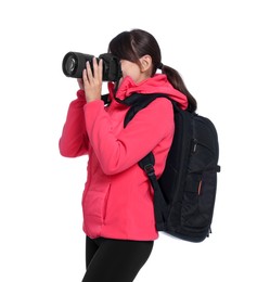 Photographer with backpack and camera taking picture on white background