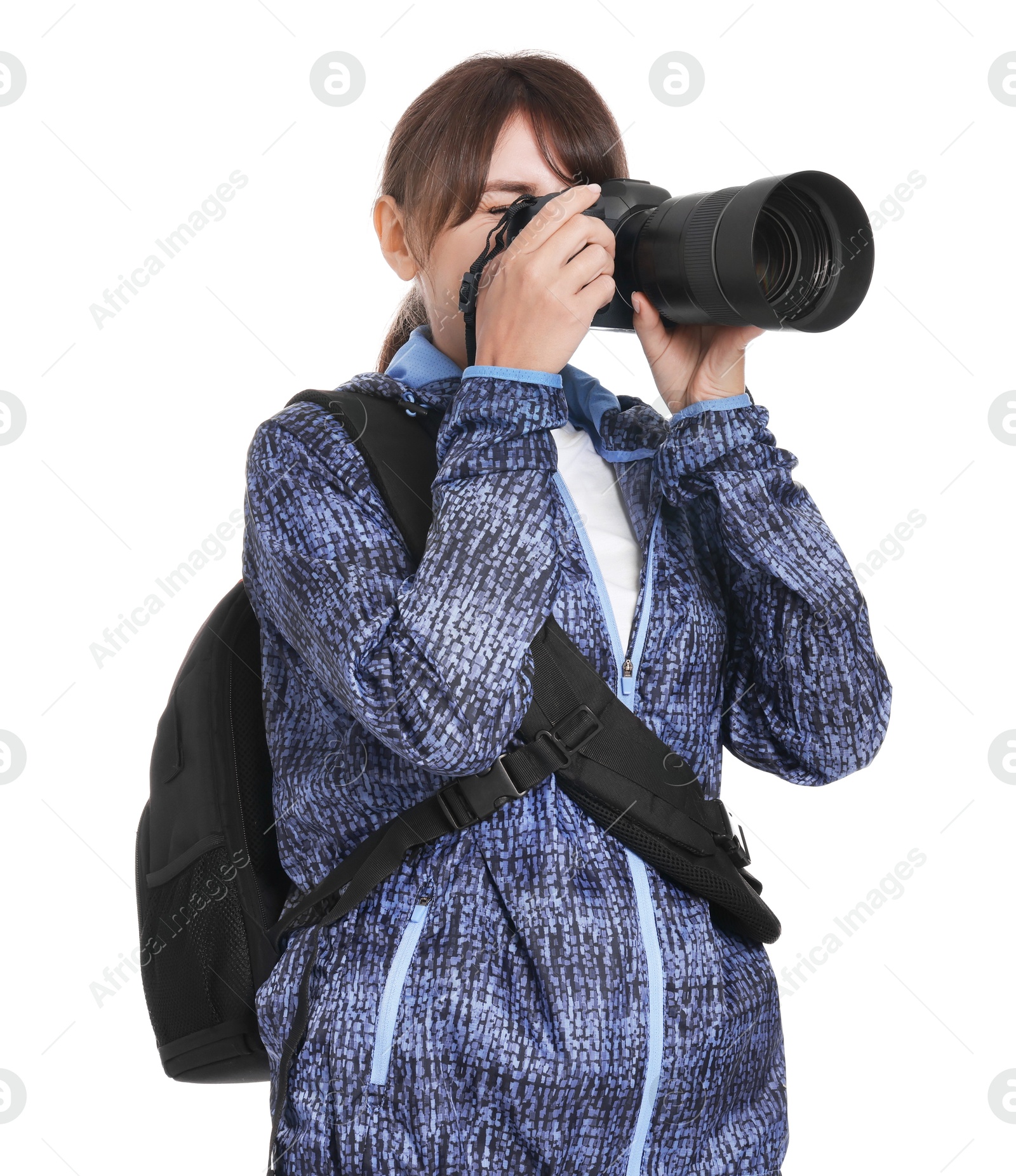 Photo of Photographer with backpack and camera taking picture on white background