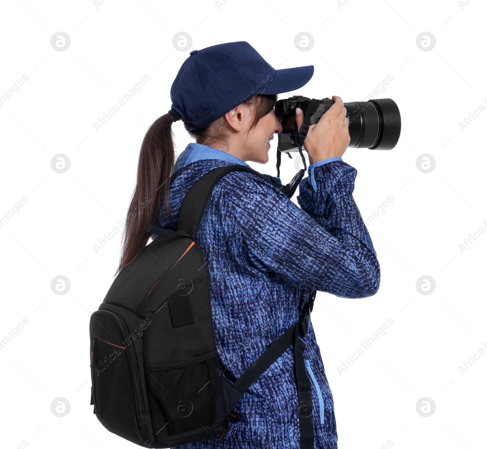 Photo of Photographer with backpack and camera taking picture on white background