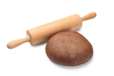 Photo of Chocolate dough and wooden rolling pin isolated on white