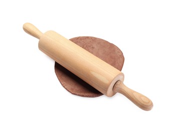 Photo of Chocolate dough and wooden rolling pin isolated on white