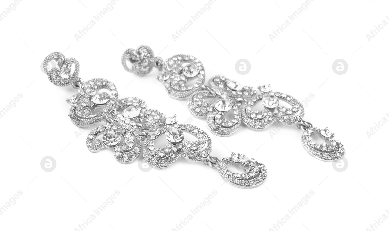 Photo of Beautiful bijouterie. Stylish earrings isolated on white