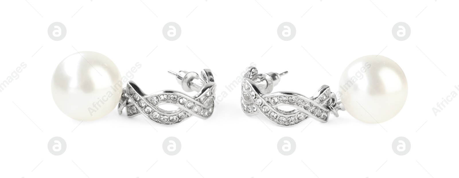 Photo of Beautiful bijouterie. Stylish earrings isolated on white