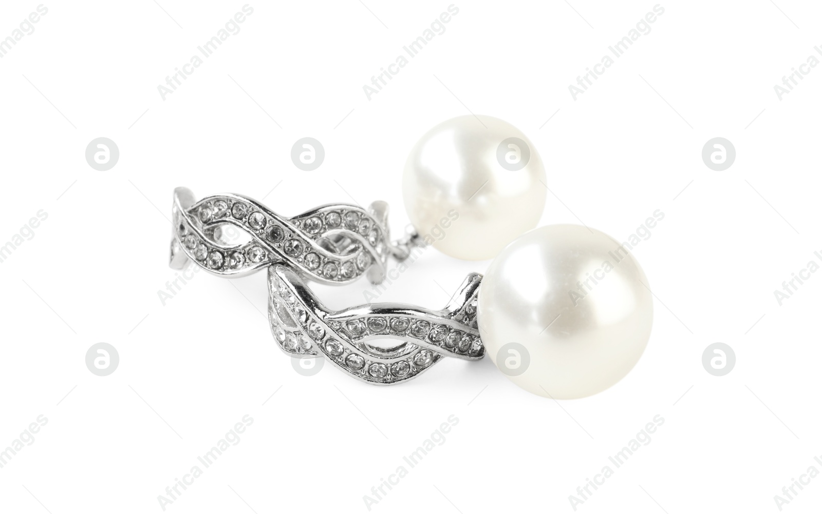 Photo of Beautiful bijouterie. Stylish earrings isolated on white