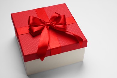 Photo of Gift box with bow on light grey background