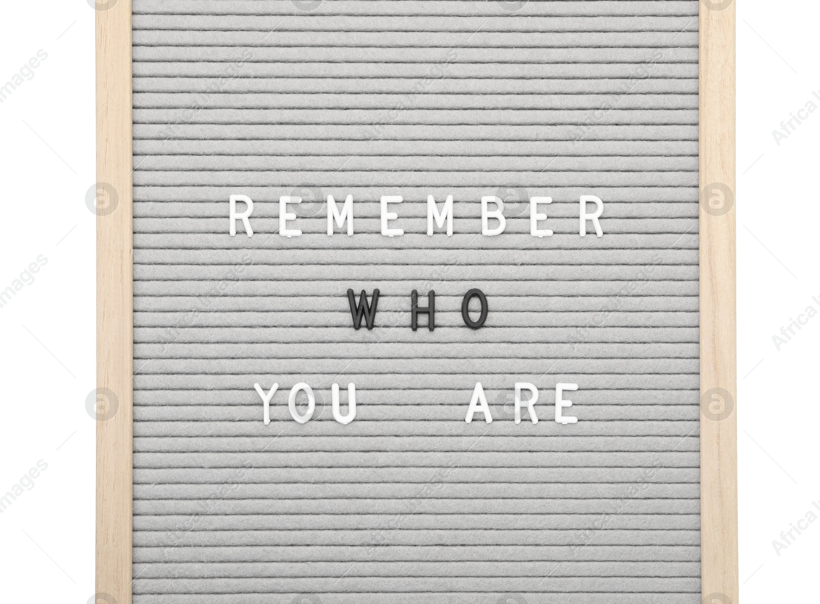 Photo of Letter board with phrase Remember who you are on white background, top view