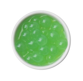 Photo of Bright tapioca pearls in bowl isolated on white, top view