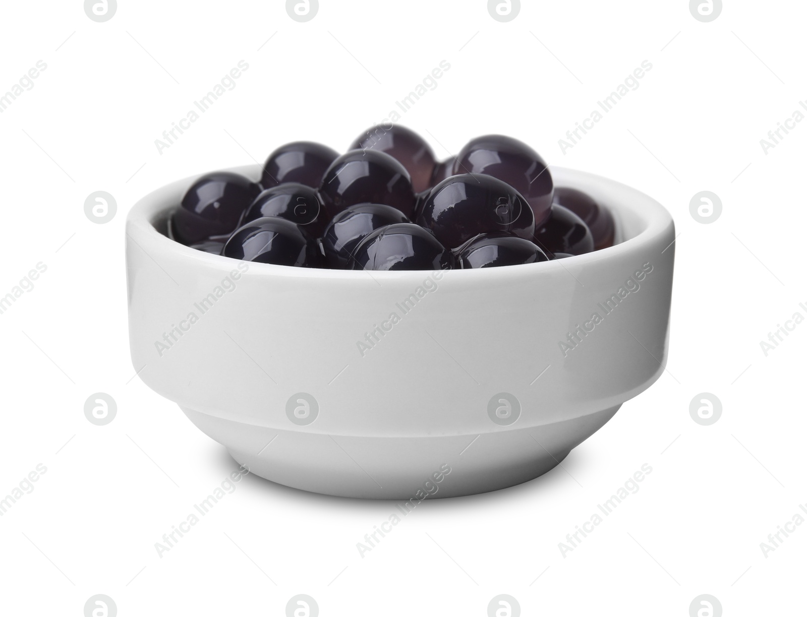 Photo of Dark tapioca pearls in bowl isolated on white