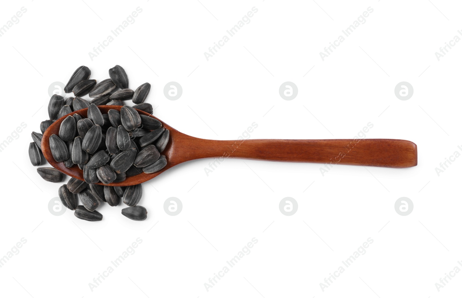 Photo of Sunflower seeds in wooden spoon isolated on white, top view