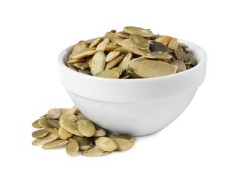 Photo of Peeled pumpkin seeds in bowl isolated on white