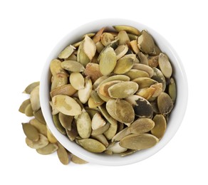 Photo of Peeled pumpkin seeds in bowl isolated on white, top view