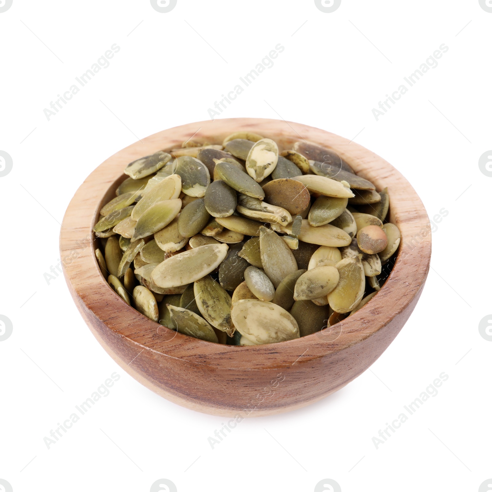 Photo of Peeled pumpkin seeds in wooden bowl isolated on white