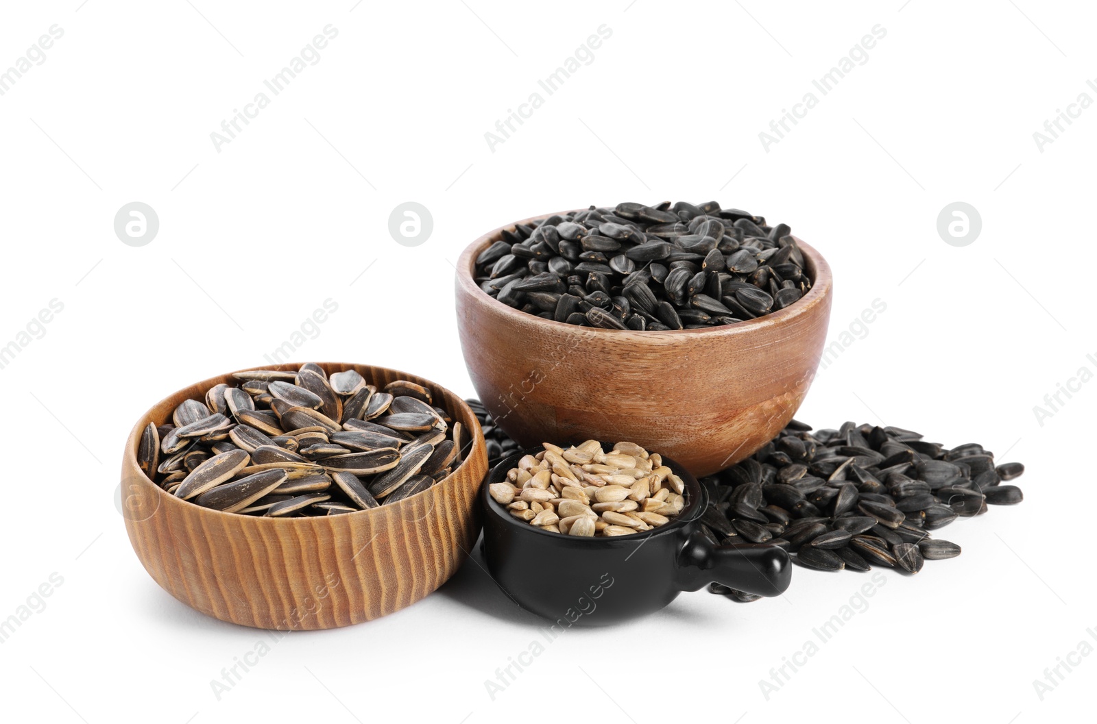 Photo of Sunflower seeds in bowls isolated on white