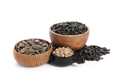 Photo of Sunflower seeds in bowls isolated on white