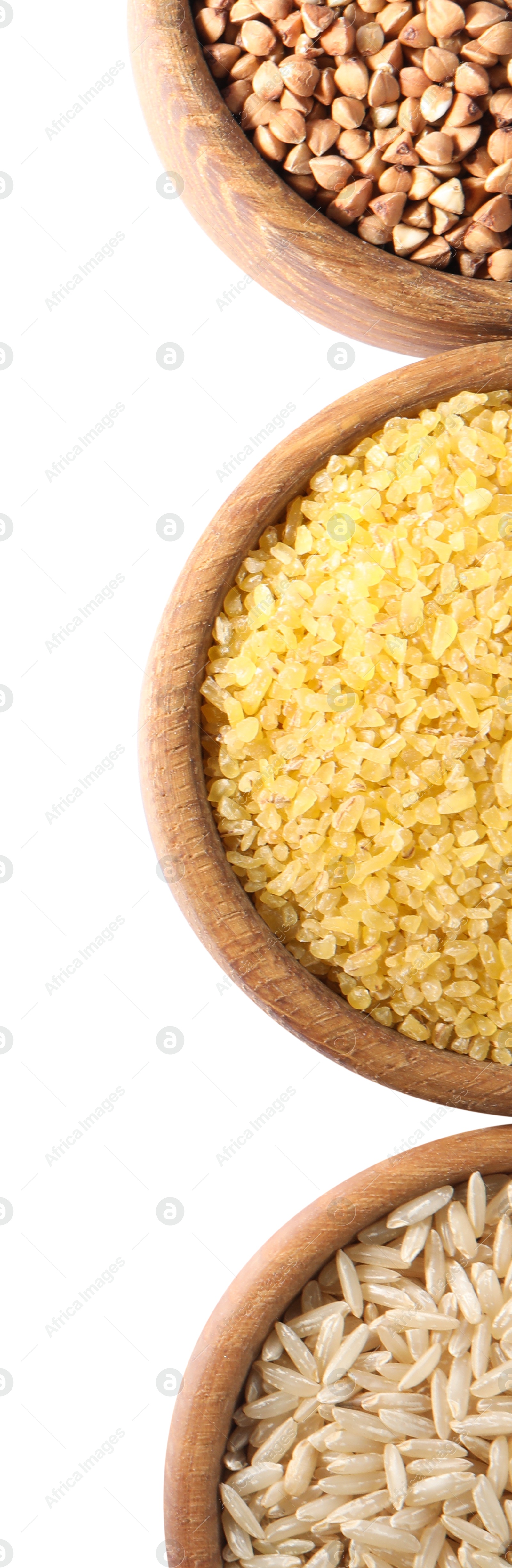 Photo of Different types of cereals in bowls isolated on white, top view