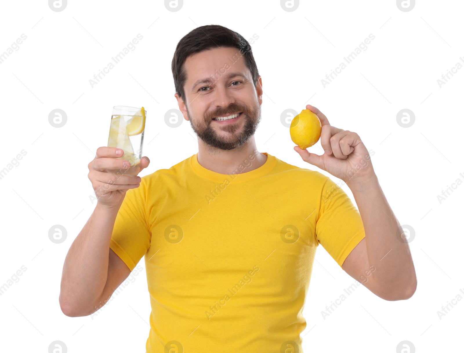 Photo of Happy man holding glass of water with lemon on white background