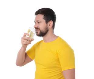 Happy man drinking water with lemon on white background