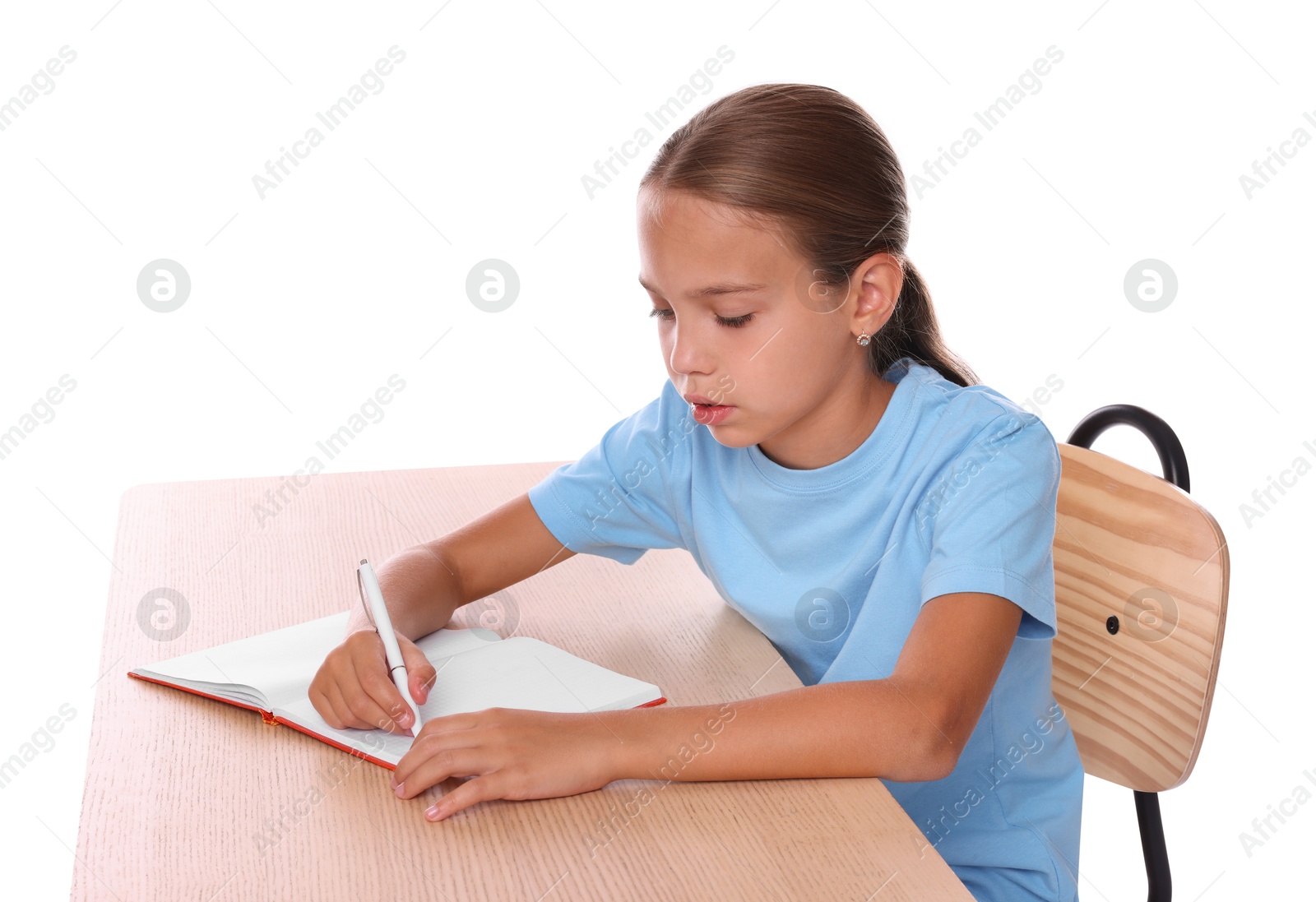 Photo of Girl with incorrect posture and notebook sitting at wooden desk on white background