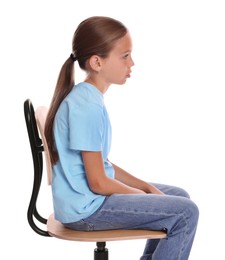 Photo of Girl with incorrect posture sitting on chair against white background