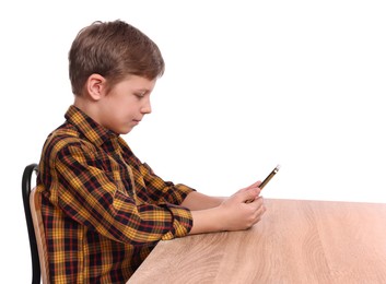 Photo of Boy with correct posture and phone at wooden desk on white background