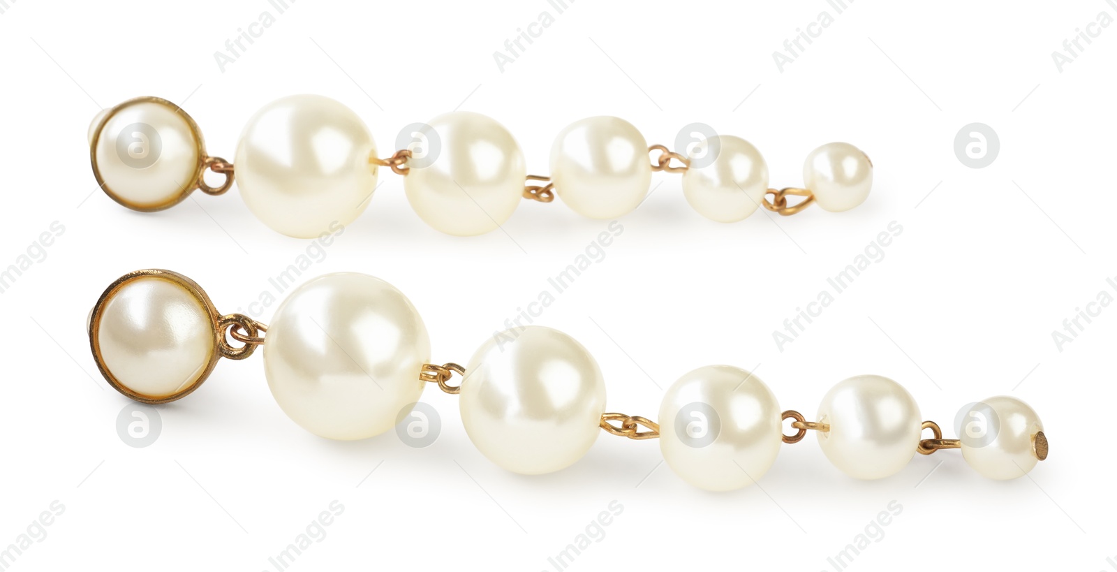 Photo of Beautiful bijouterie. Stylish earrings isolated on white