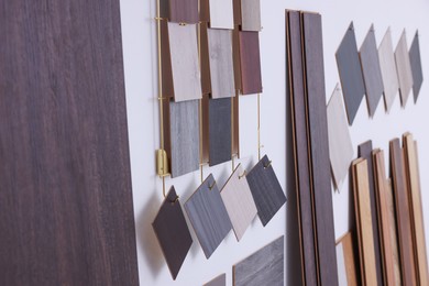 Photo of Many different samples of wooden flooring in store