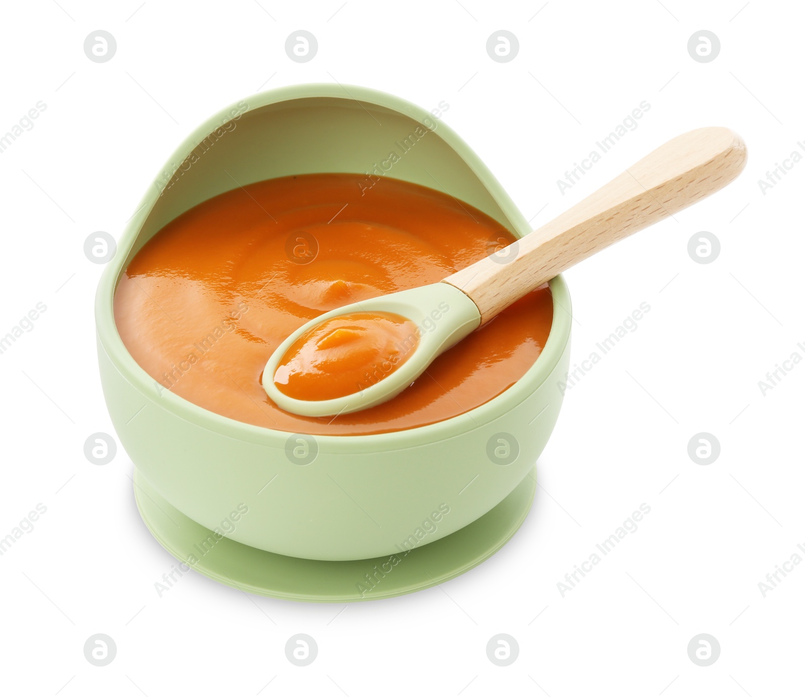 Photo of Tasty baby food and spoon in bowl isolated on white