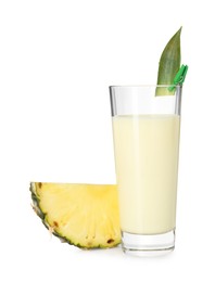 Photo of Tasty pineapple smoothie in glass and slice of fruit isolated on white