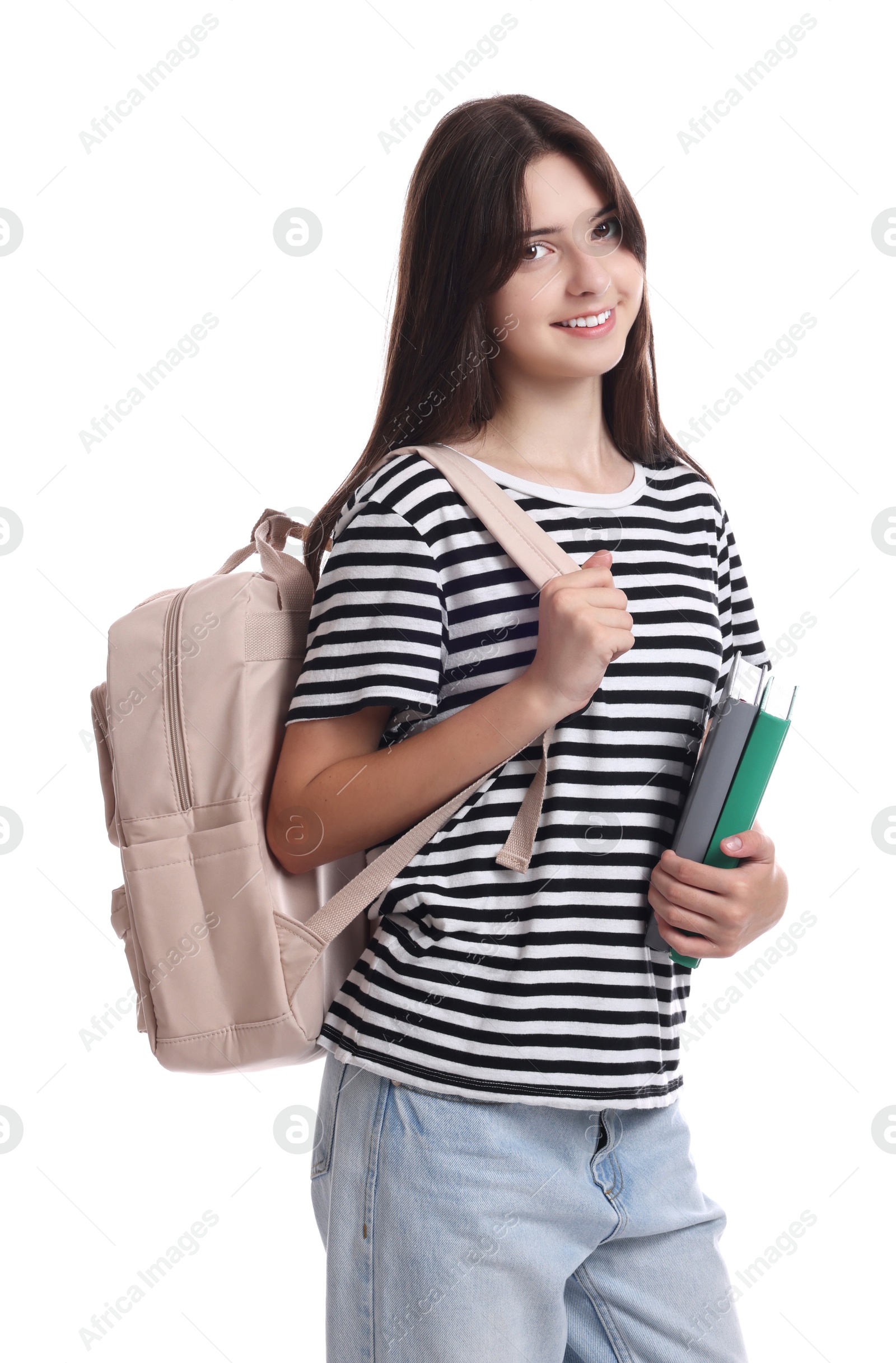 Photo of Portrait of cute teenage girl with backpack and books on white background