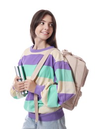 Portrait of smiling teenage girl with backpack and books on white background