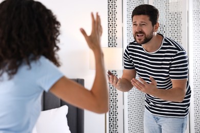 Photo of Emotional couple arguing at home. Relationship problems