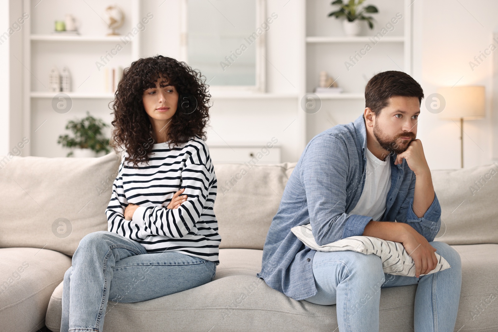 Photo of Couple having quarrel on sofa at home. Relationship problems