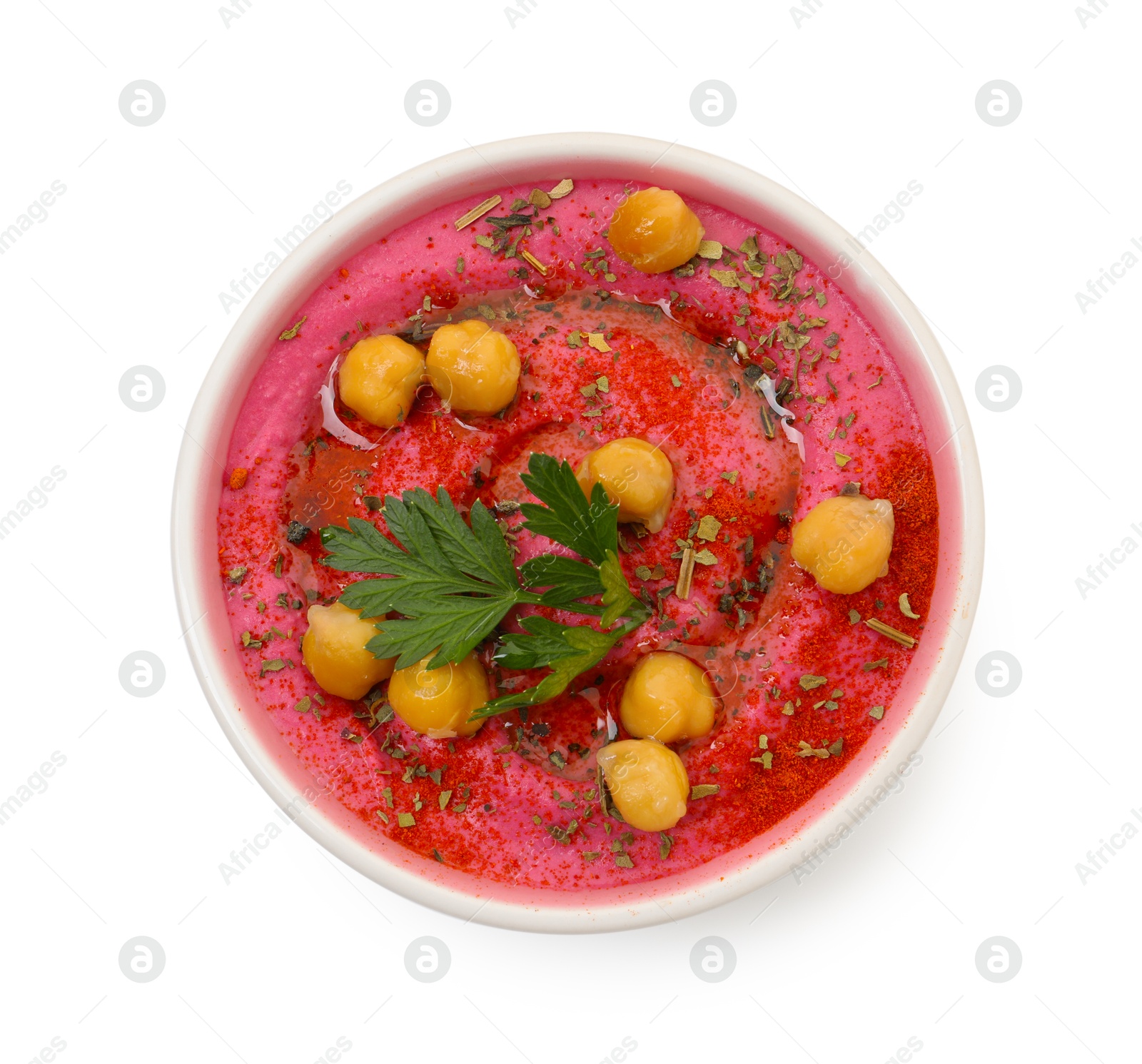 Photo of Tasty beetroot hummus and chickpeas in bowl isolated on white, top view