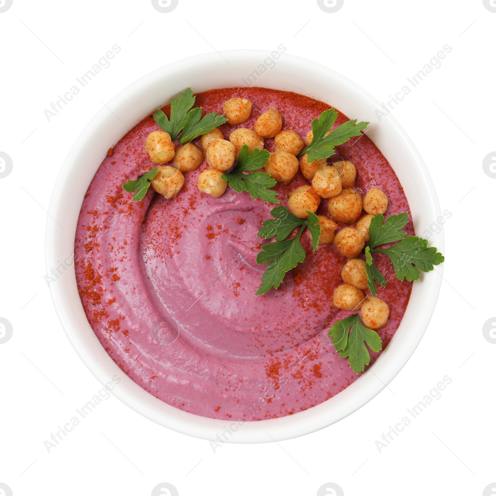 Photo of Tasty beetroot hummus and chickpeas in bowl isolated on white, top view