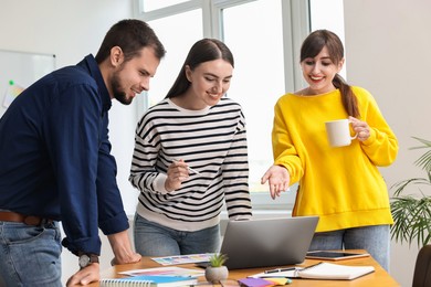 Group of designers working together in office