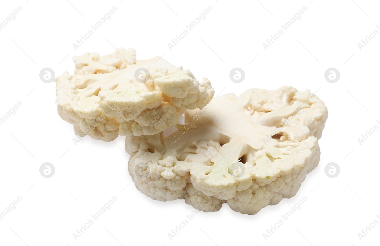 Photo of Two uncooked cauliflower steaks isolated on white