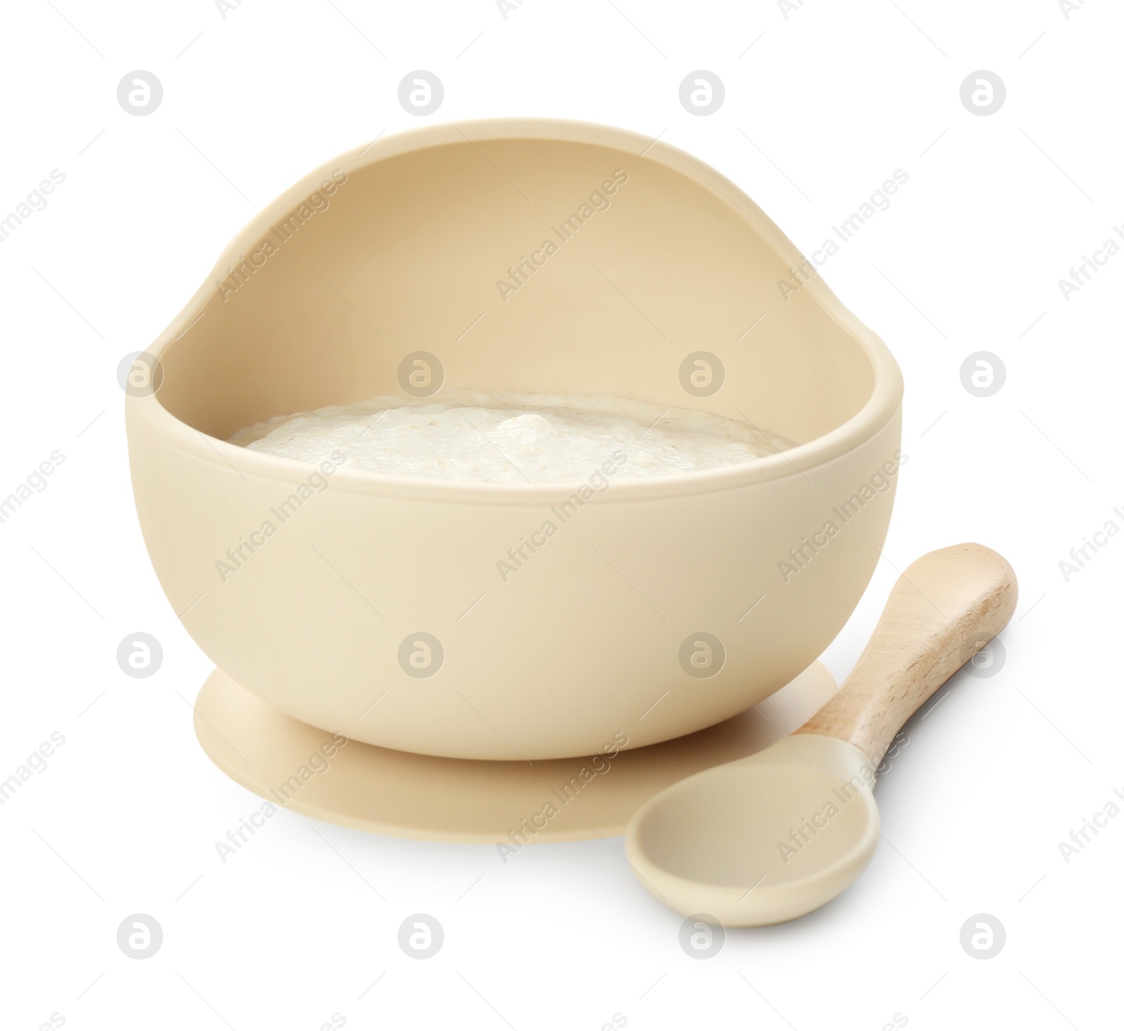 Photo of Delicious baby food in bowl and spoon isolated on white