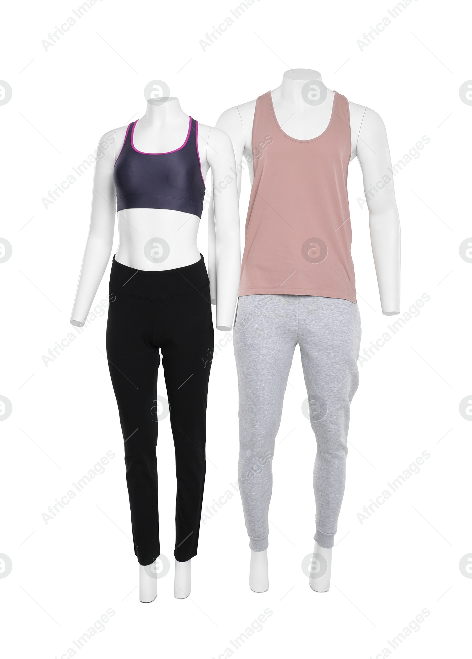 Photo of Female and male mannequins with stylish sportswear isolated on white