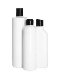 Photo of Bottles of shampoo isolated on white. Personal care product