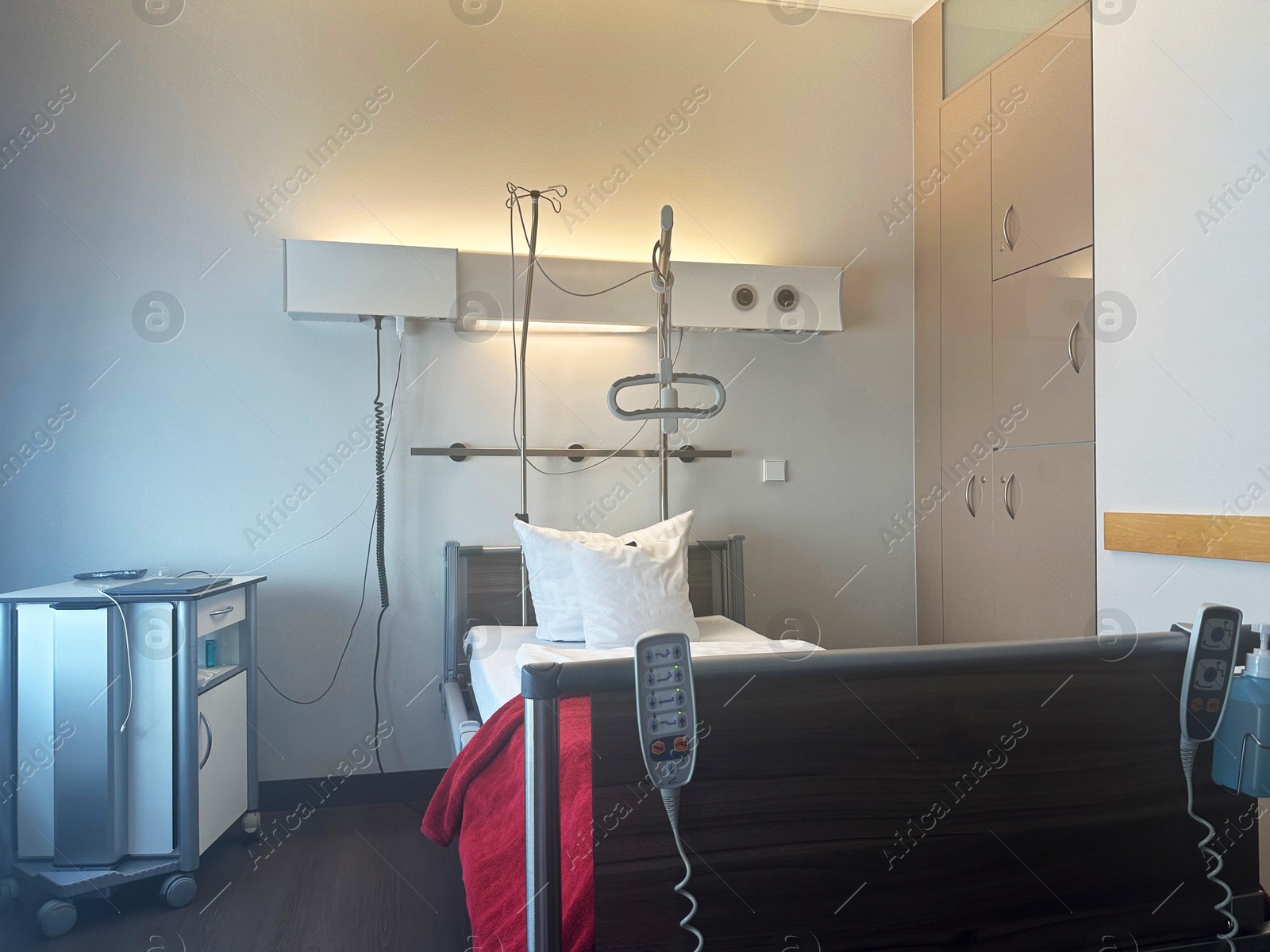 Photo of Modern interior of hospital ward with bed