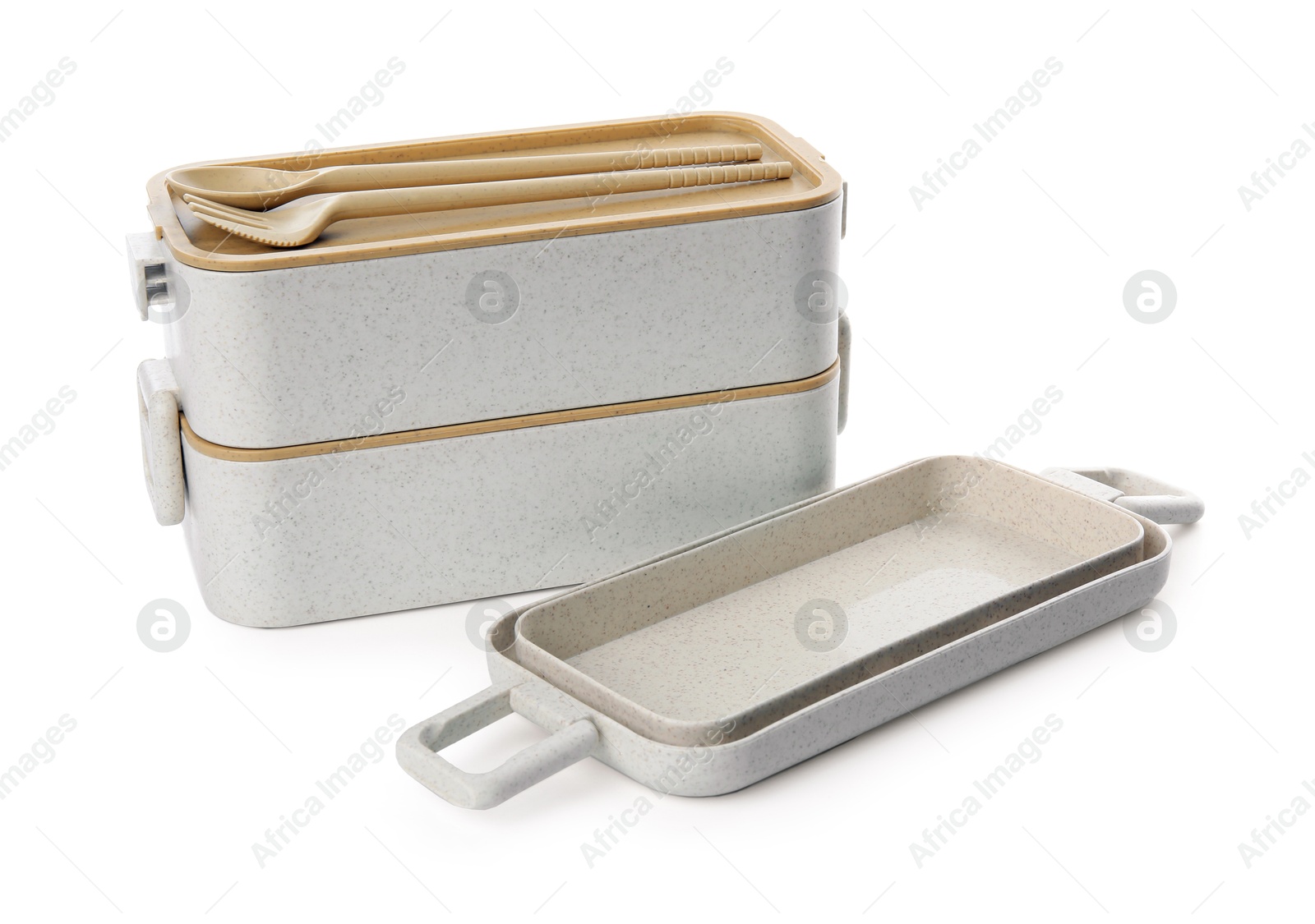 Photo of Compartments of plastic lunch box with cutlery isolated on white