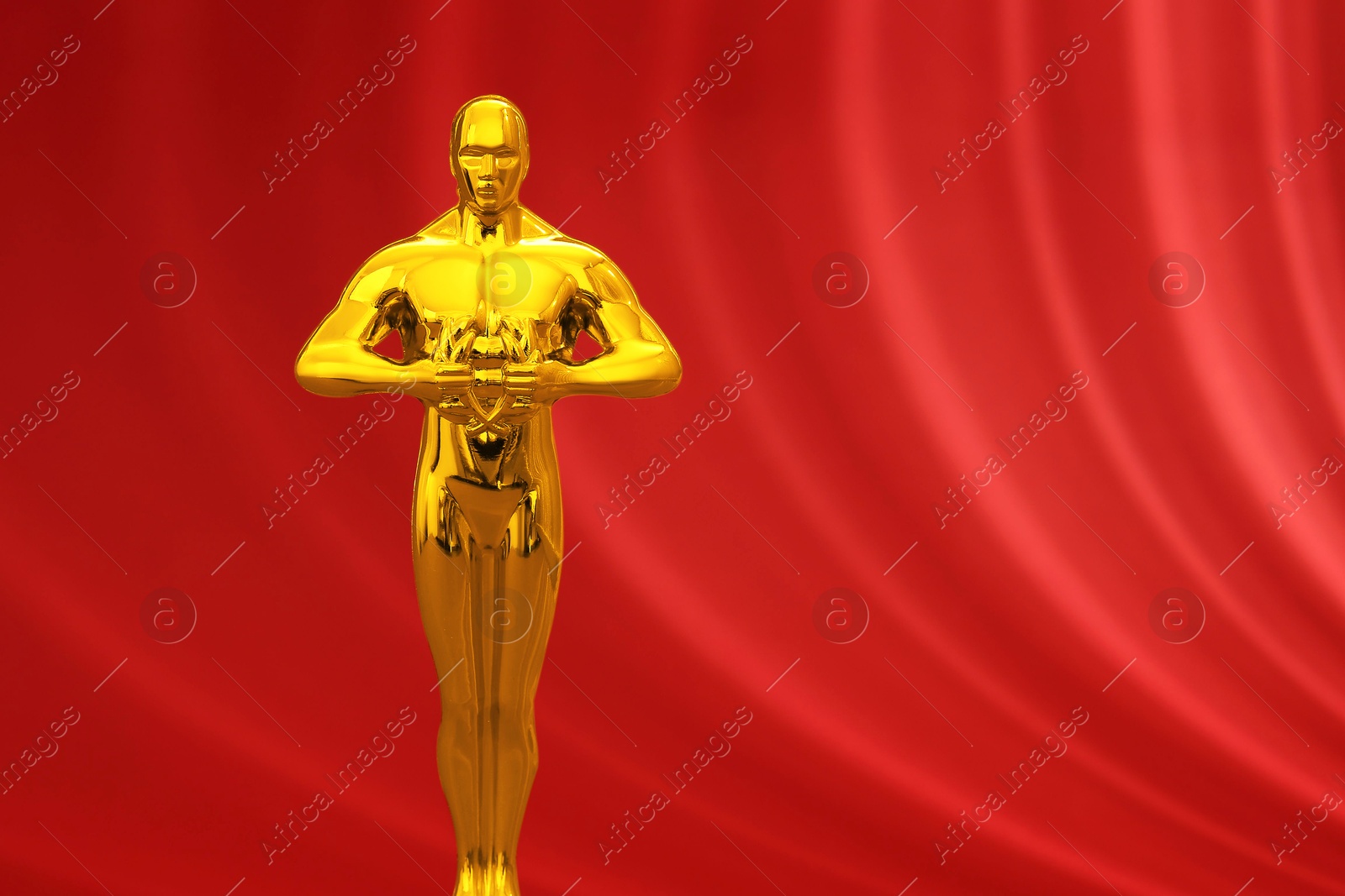 Photo of One golden Oscar award on red background, space for text