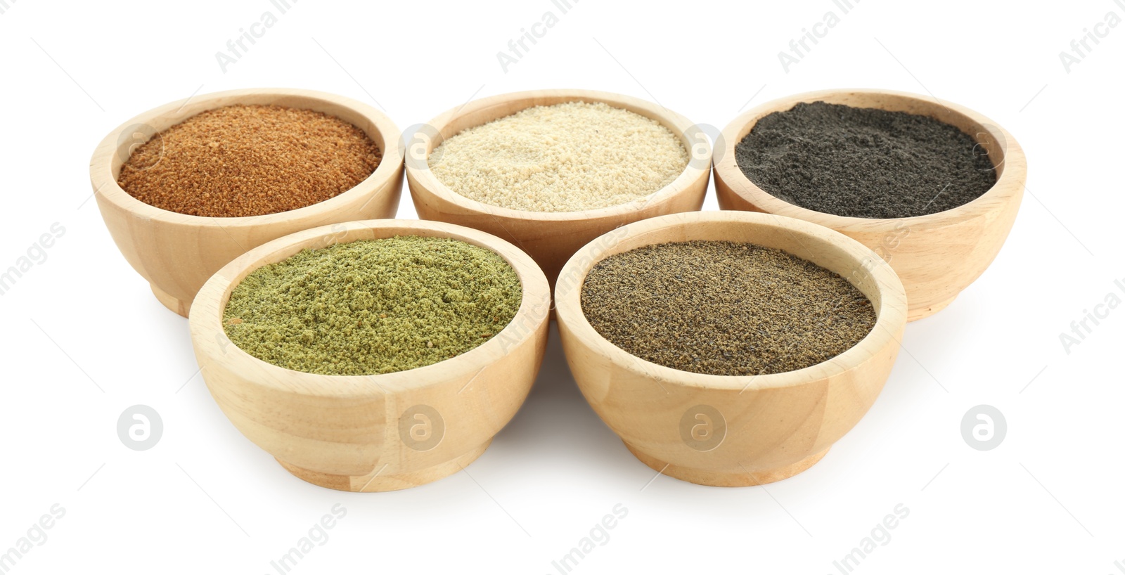 Photo of Different superfood powders in bowls isolated on white