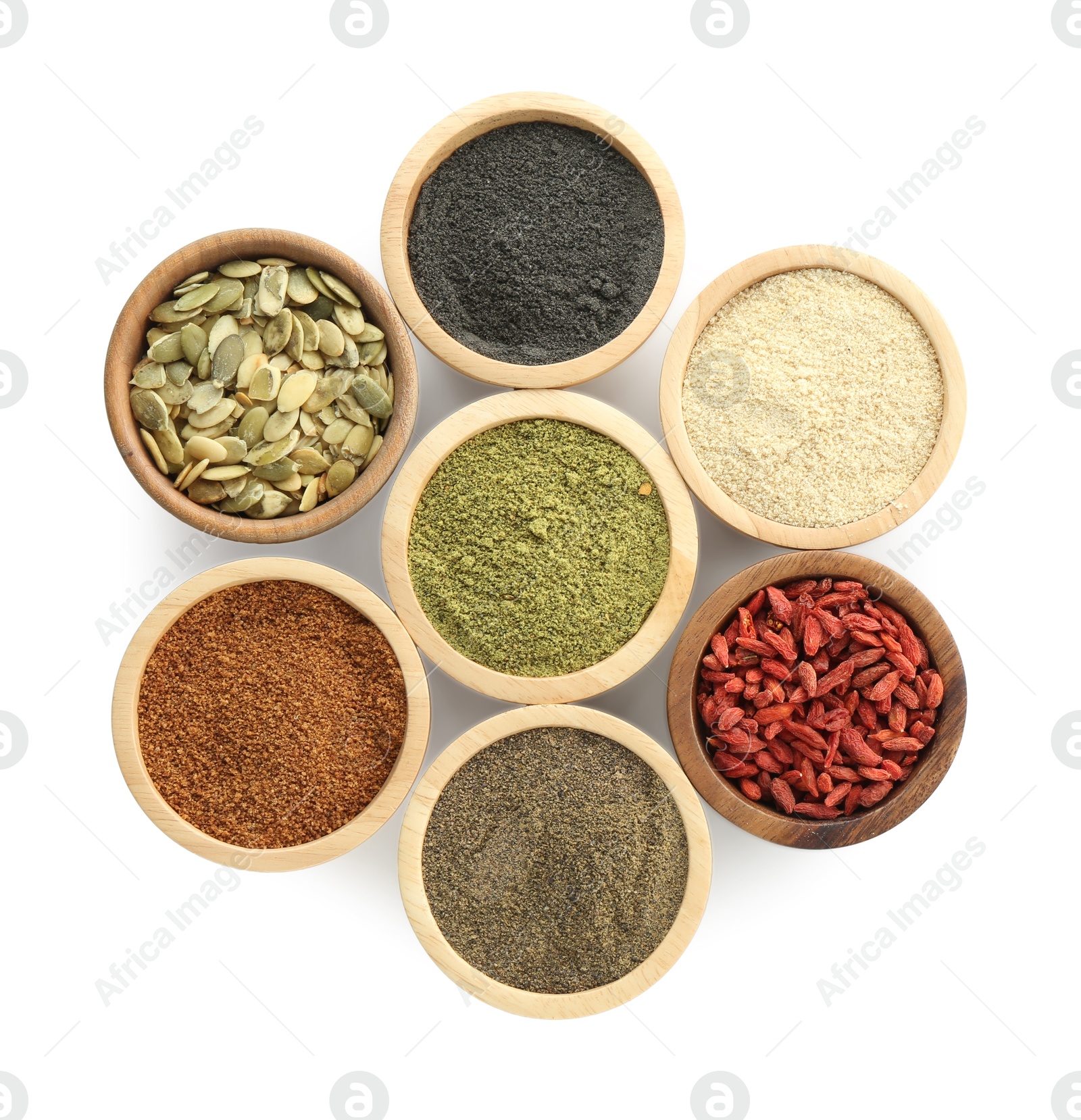 Photo of Different superfood powders, pumpkin seeds and goji berries in bowls isolated on white, top view