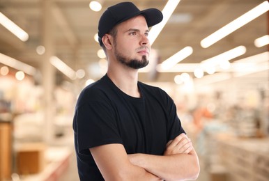 Portrait of confident security guard in shopping mall