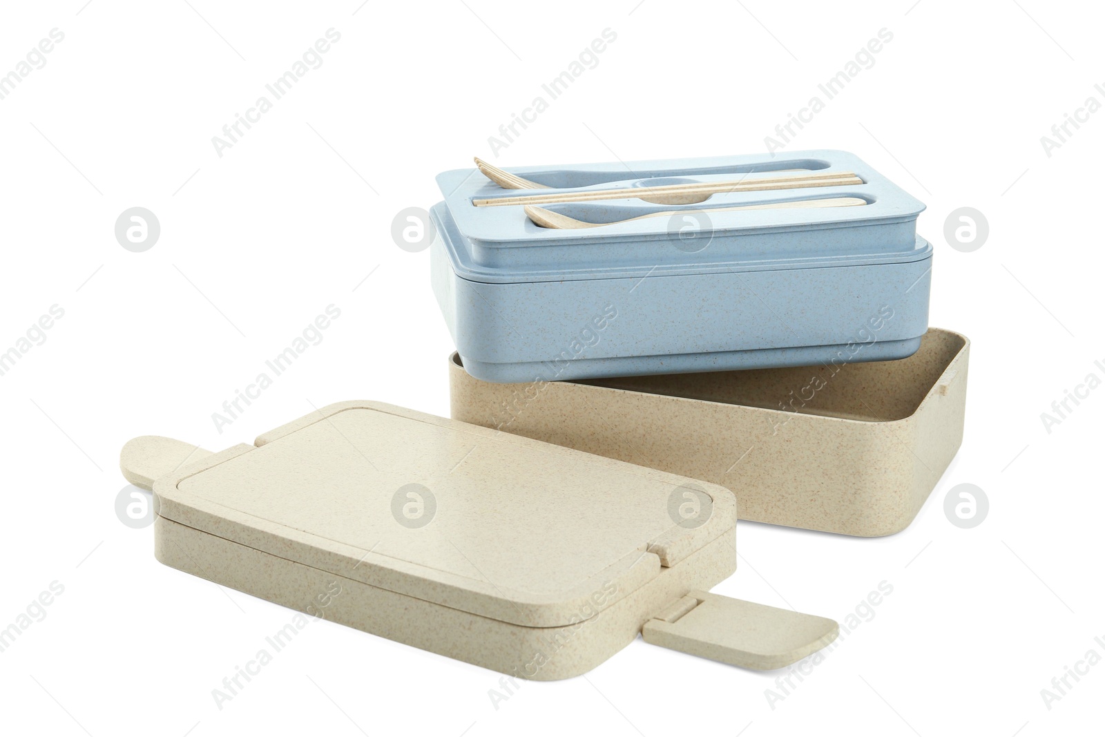 Photo of Compartments of plastic lunch box with cutlery isolated on white