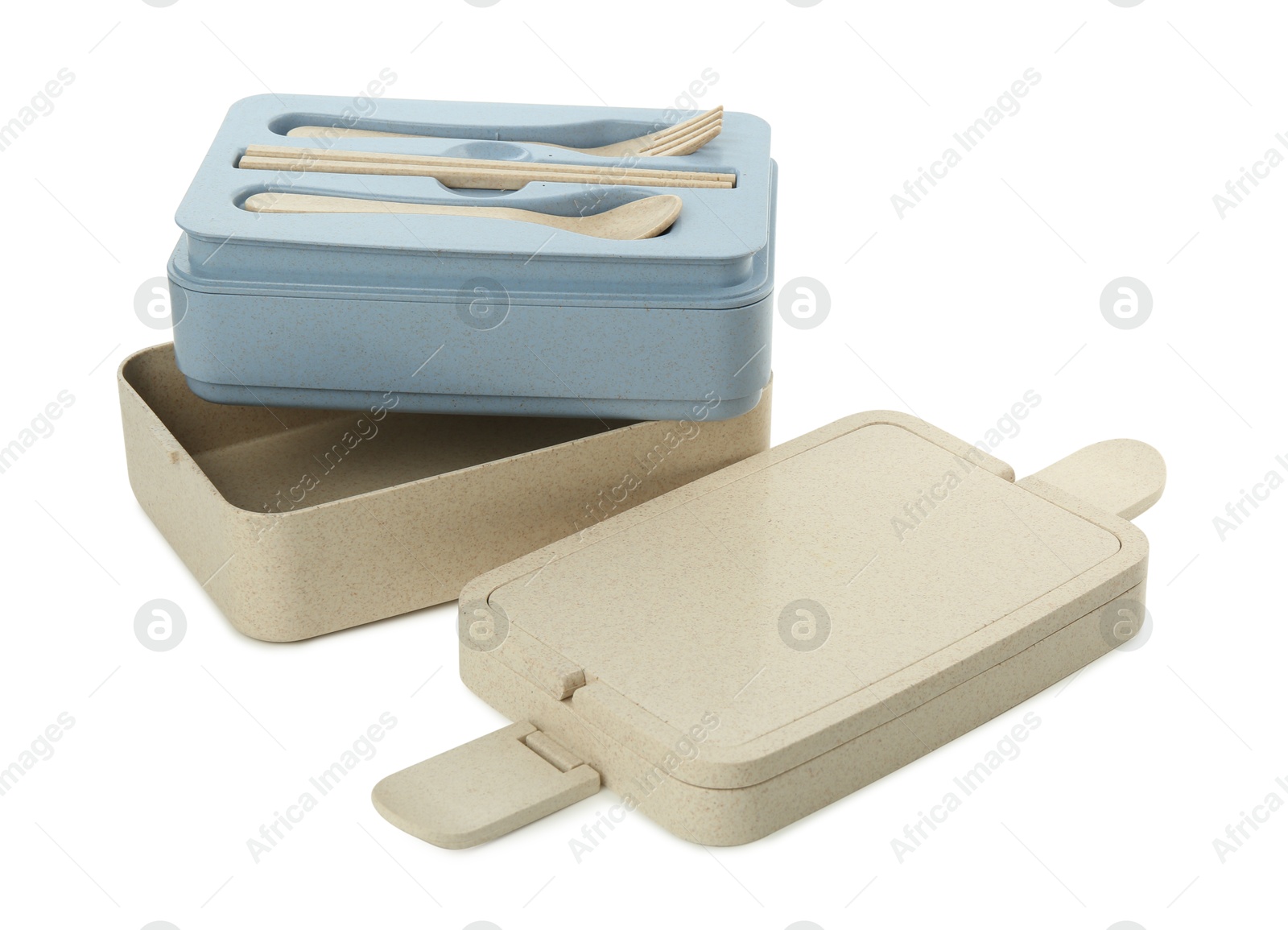 Photo of Compartments of plastic lunch box with cutlery isolated on white