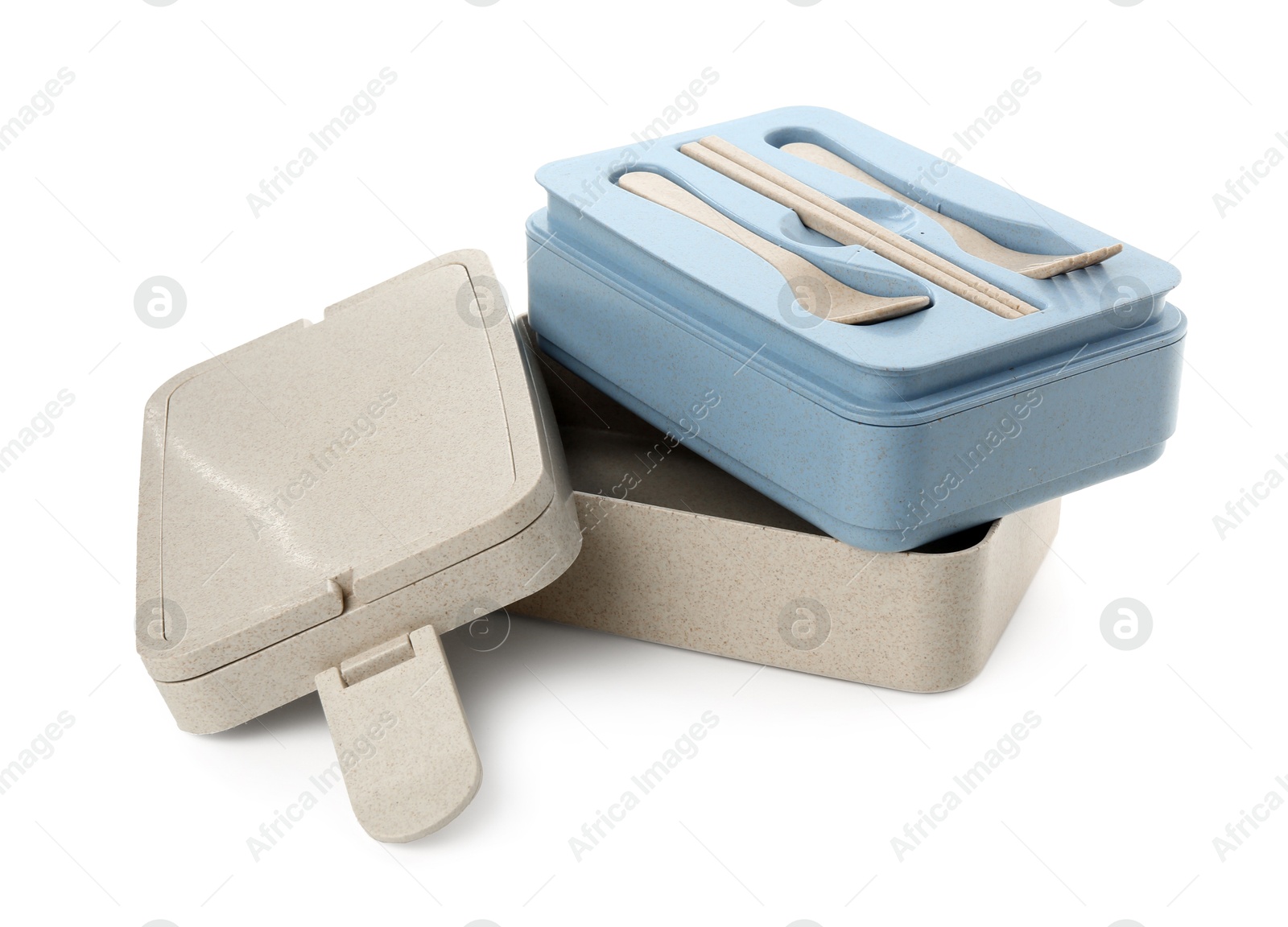 Photo of Compartments of plastic lunch box with cutlery isolated on white