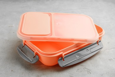 Photo of Empty plastic lunch box on grey table, closeup