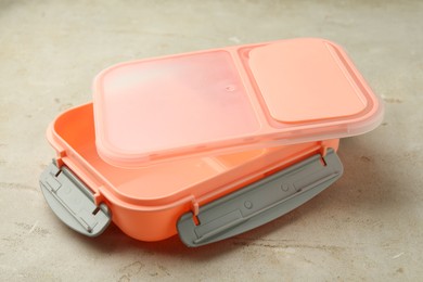 Photo of Empty plastic lunch box on grey table, closeup